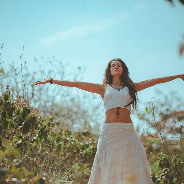 Person meditating peacefully in a calm environment.